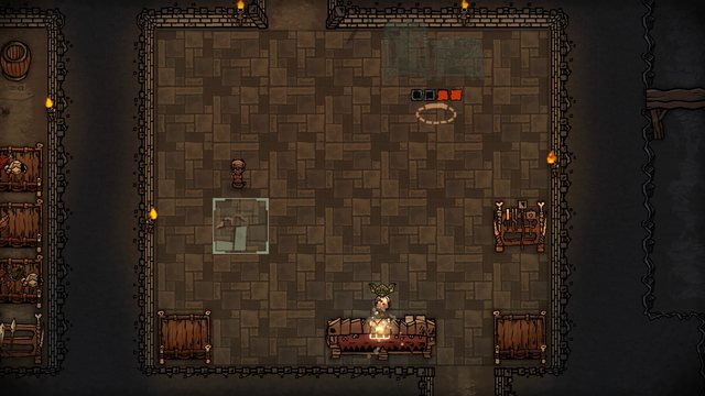 In the new smithy, a goblin works at a crafting bench while an anvil is still under construction.