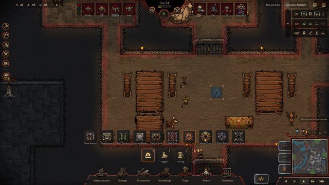 The Traps build menu, from the Flame Sprayer to the Spider Trap, with the ghost of a Blast Trap in the Great Hall.
